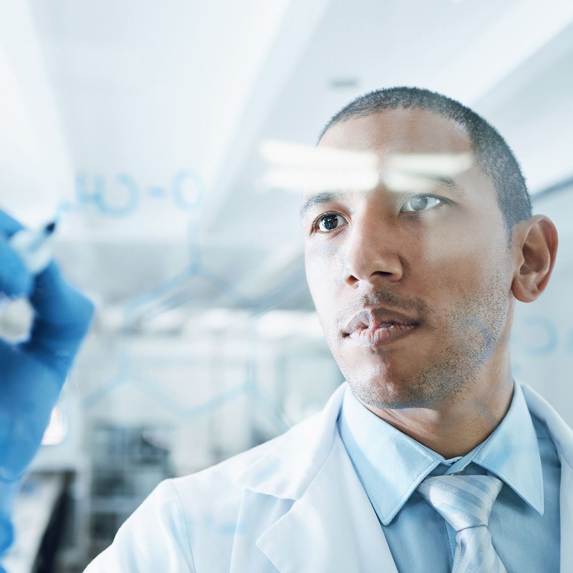 clinical affairs employee with marker on white board