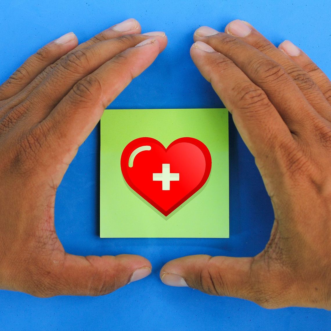 hands holding a heart in the center