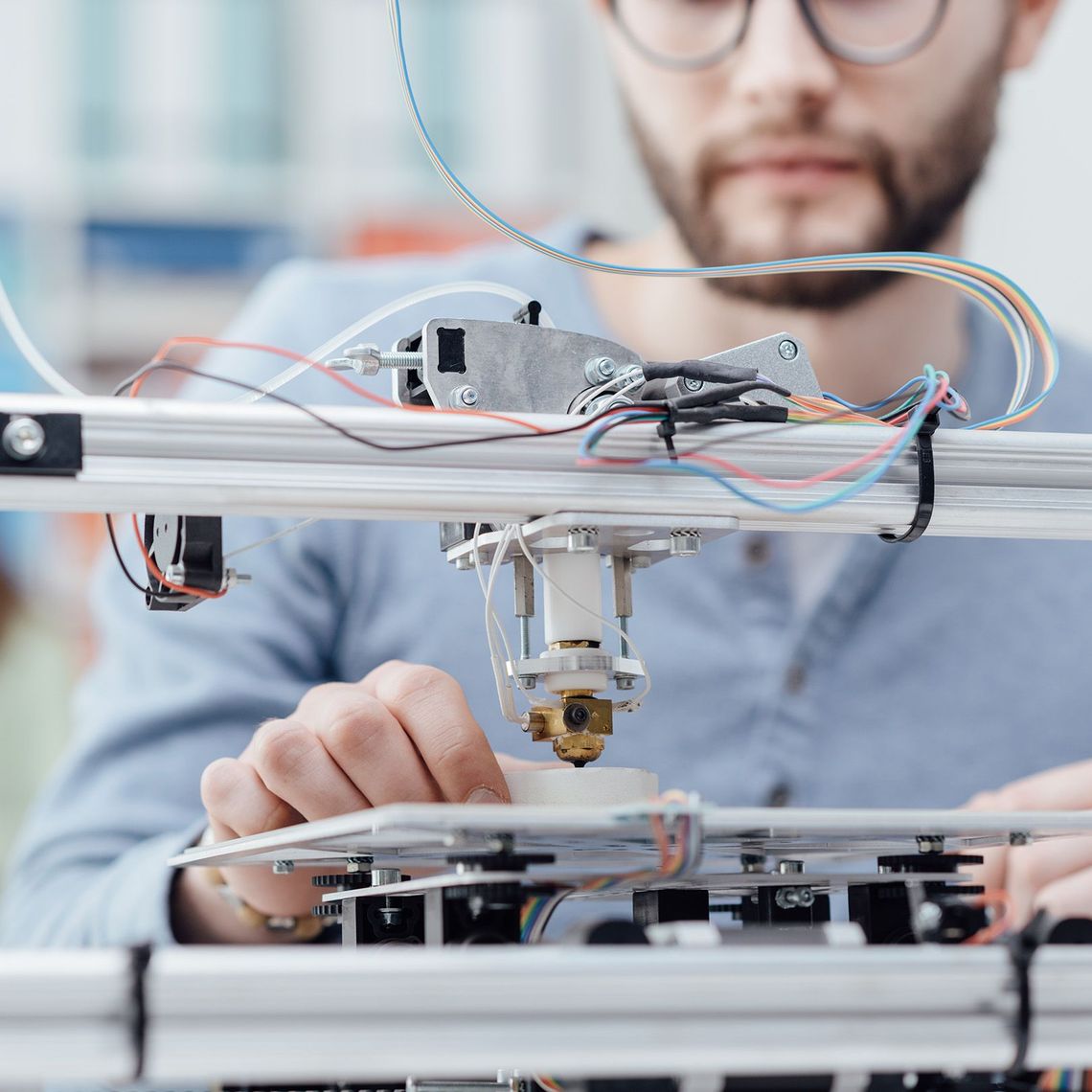 engineering employee at a machine