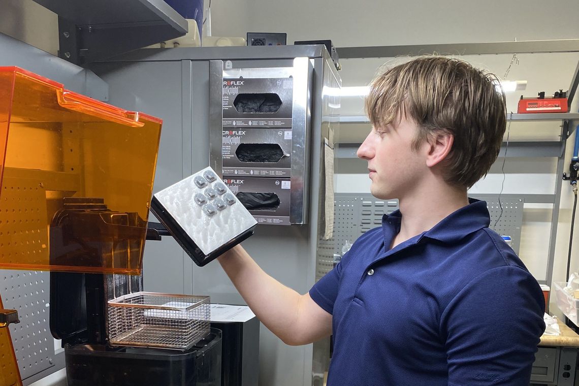 Intern working with a machine